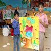 Children Showing Painting on Save Earth