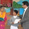 Child Receving Prize on Matra Bhasha Divas