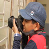Child Taking Photograph