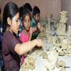 Children playing and learning with Clay