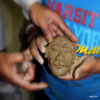 Child Displaying Clay Mask