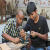 Children Cutting Wood for Making Toy